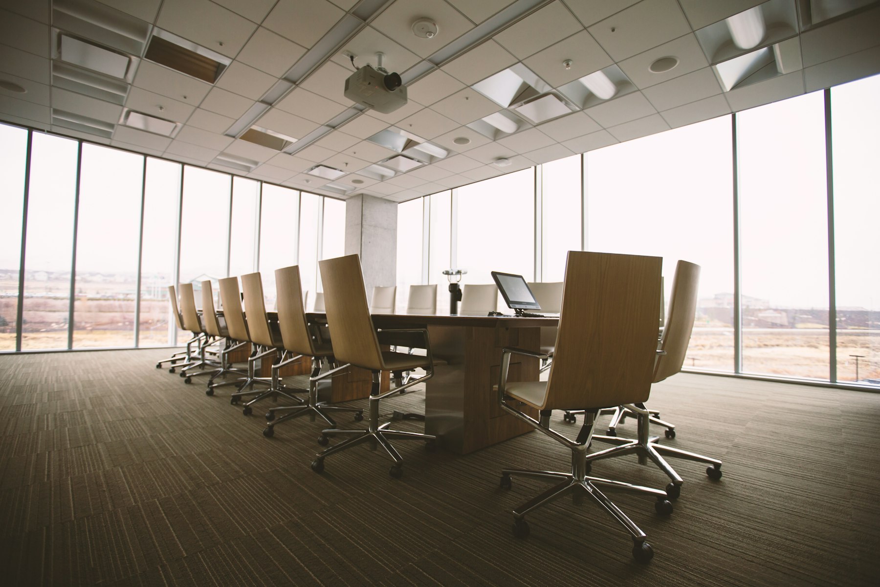 A long conference table in a high-floor office.