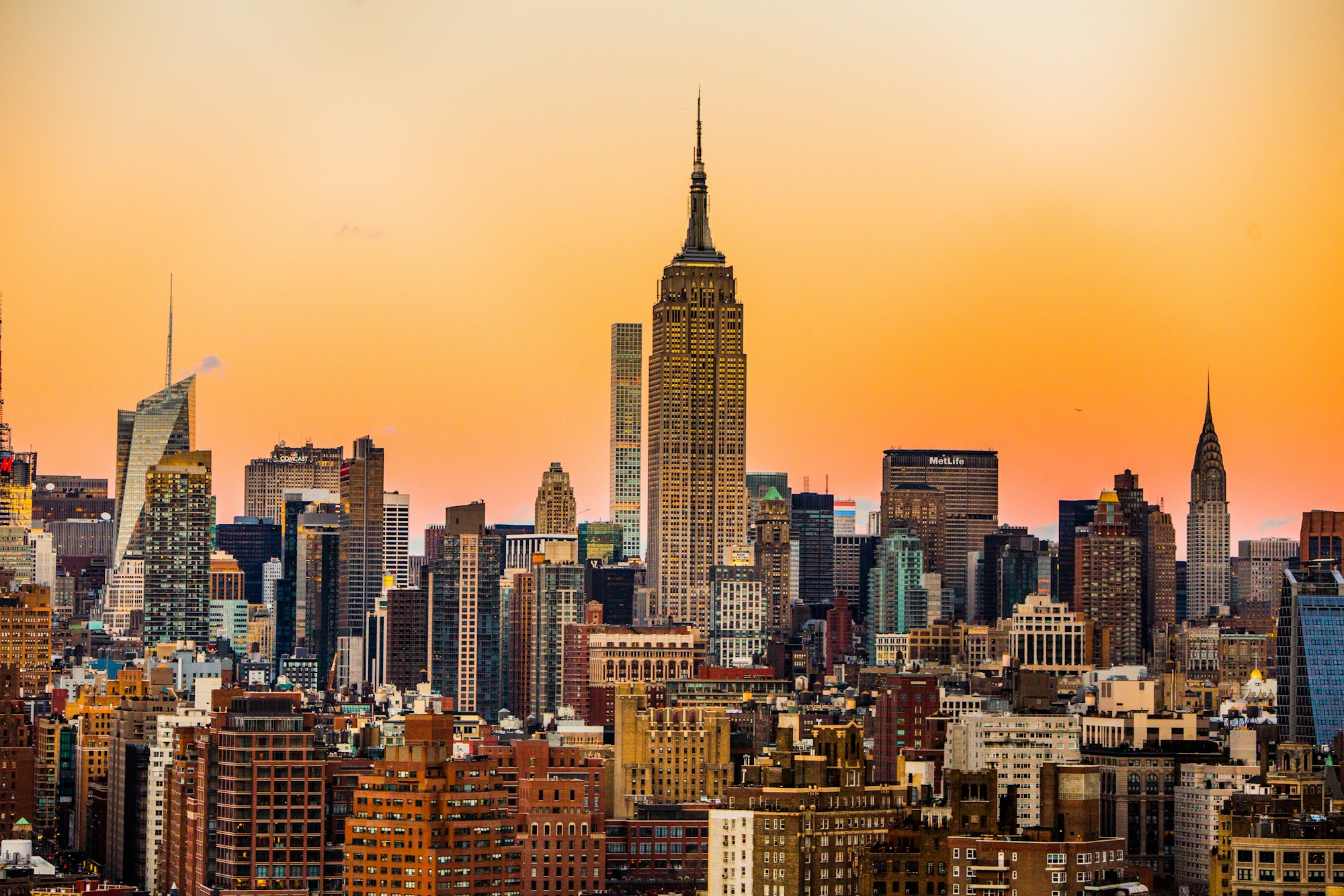 Manhattan at dusk, the Empire State Building over the city.